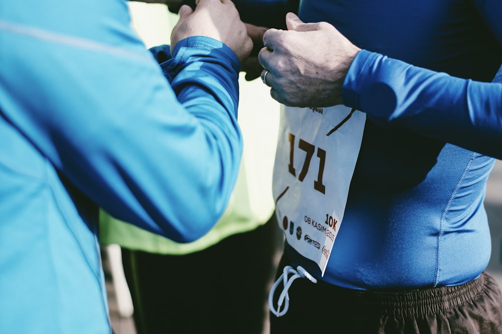 person in blue wetsuit with 171 number