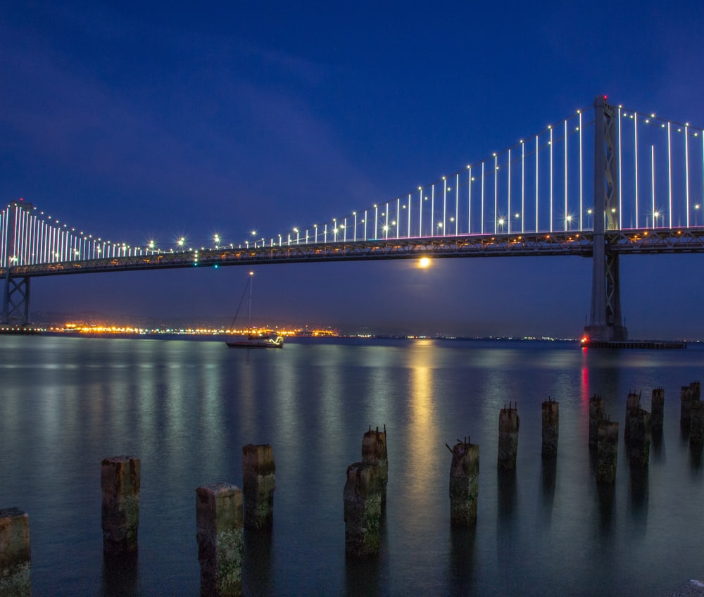 bridge over body of water with lights