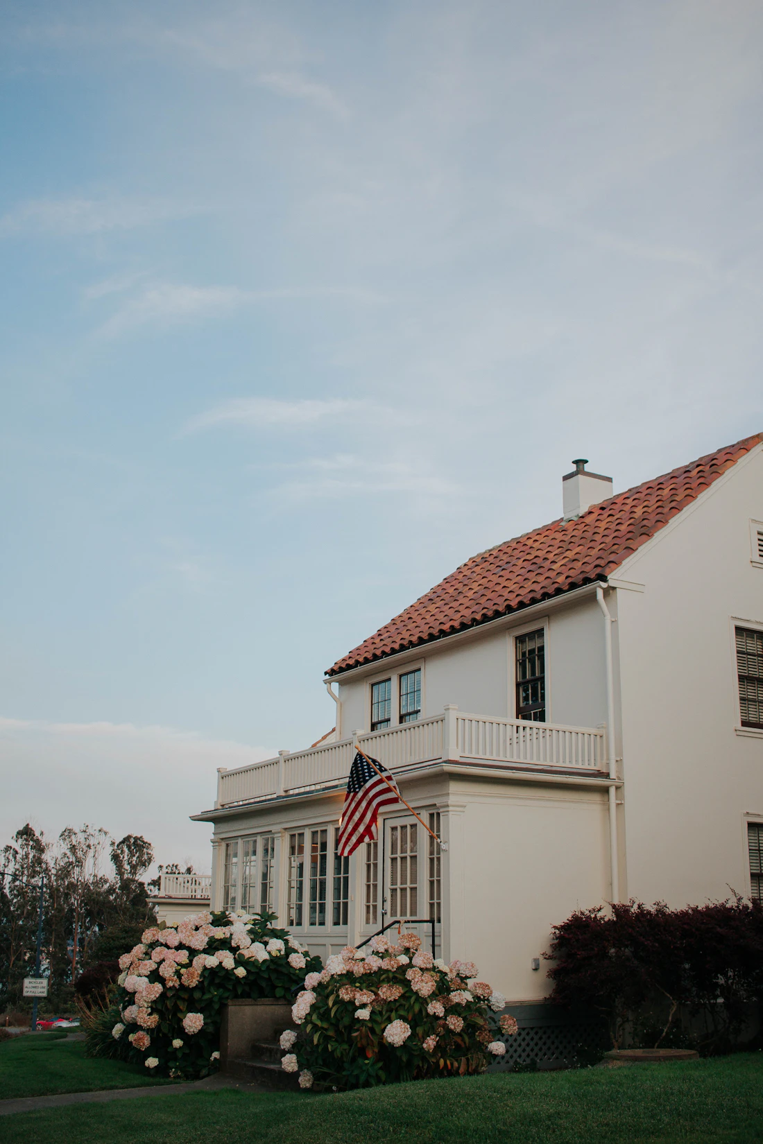 A classic, well-kept American home with a front porch