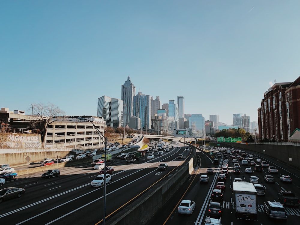 vehicles on road near buildings during daytime