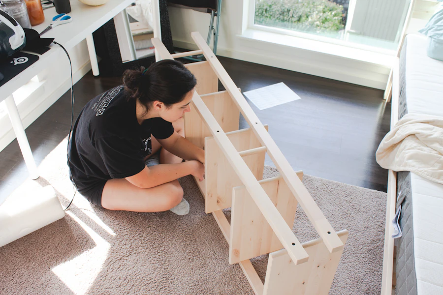 Person assembling wooden furniture at home