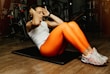 exercising woman on mat