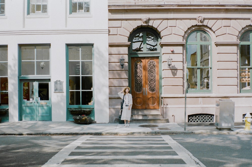 woman beside pedestrian lane