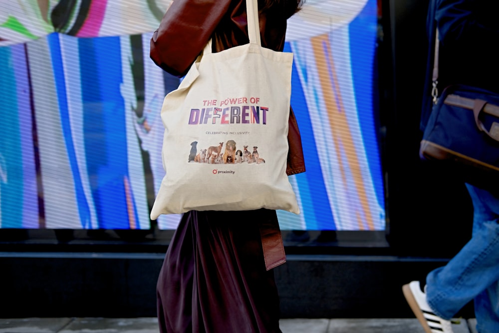 woman holding tote bag