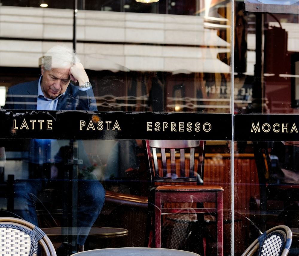 sitting man in coffee shop