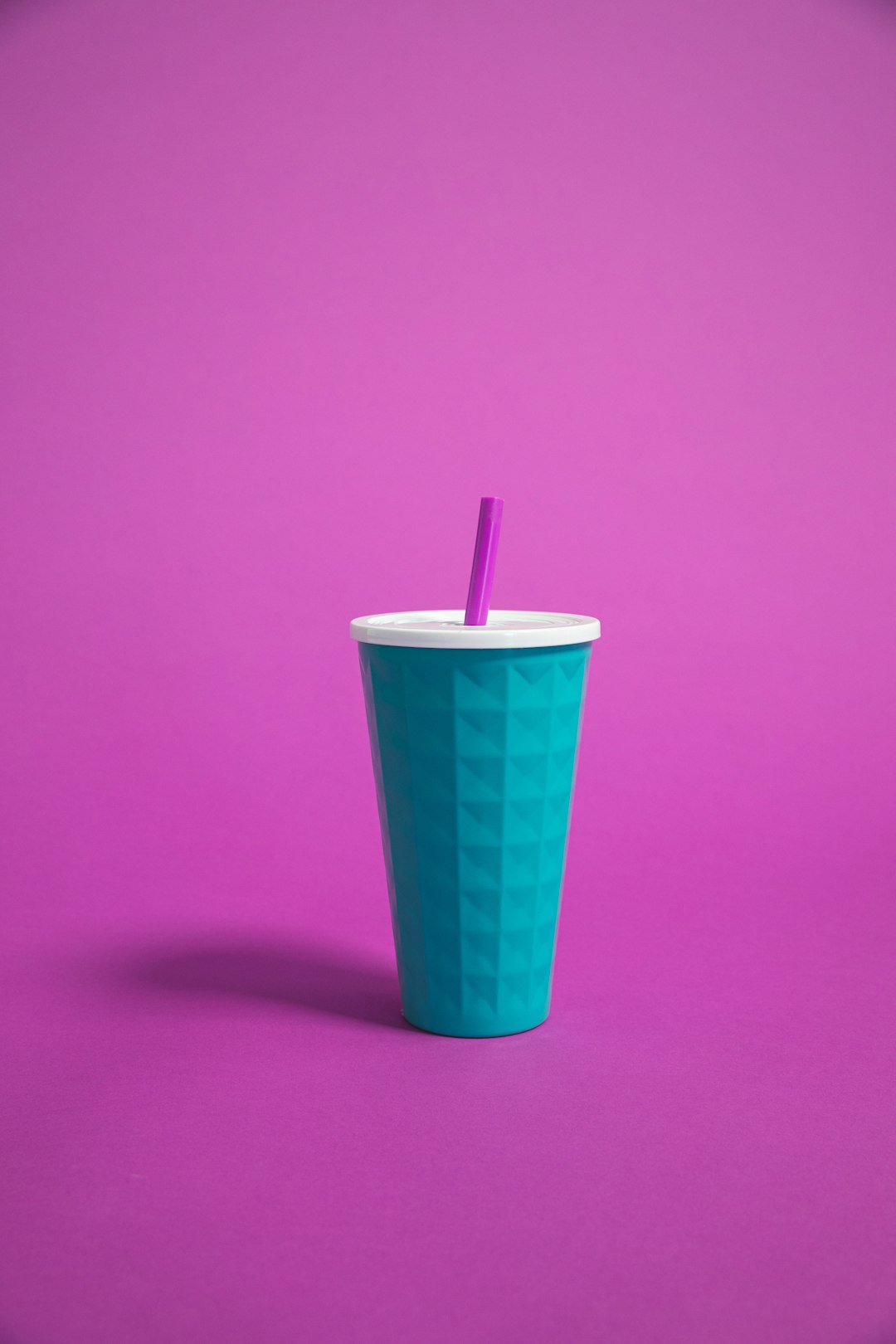 blue cup with straw