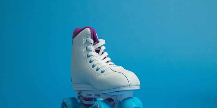 unpaired white and blue roller skate