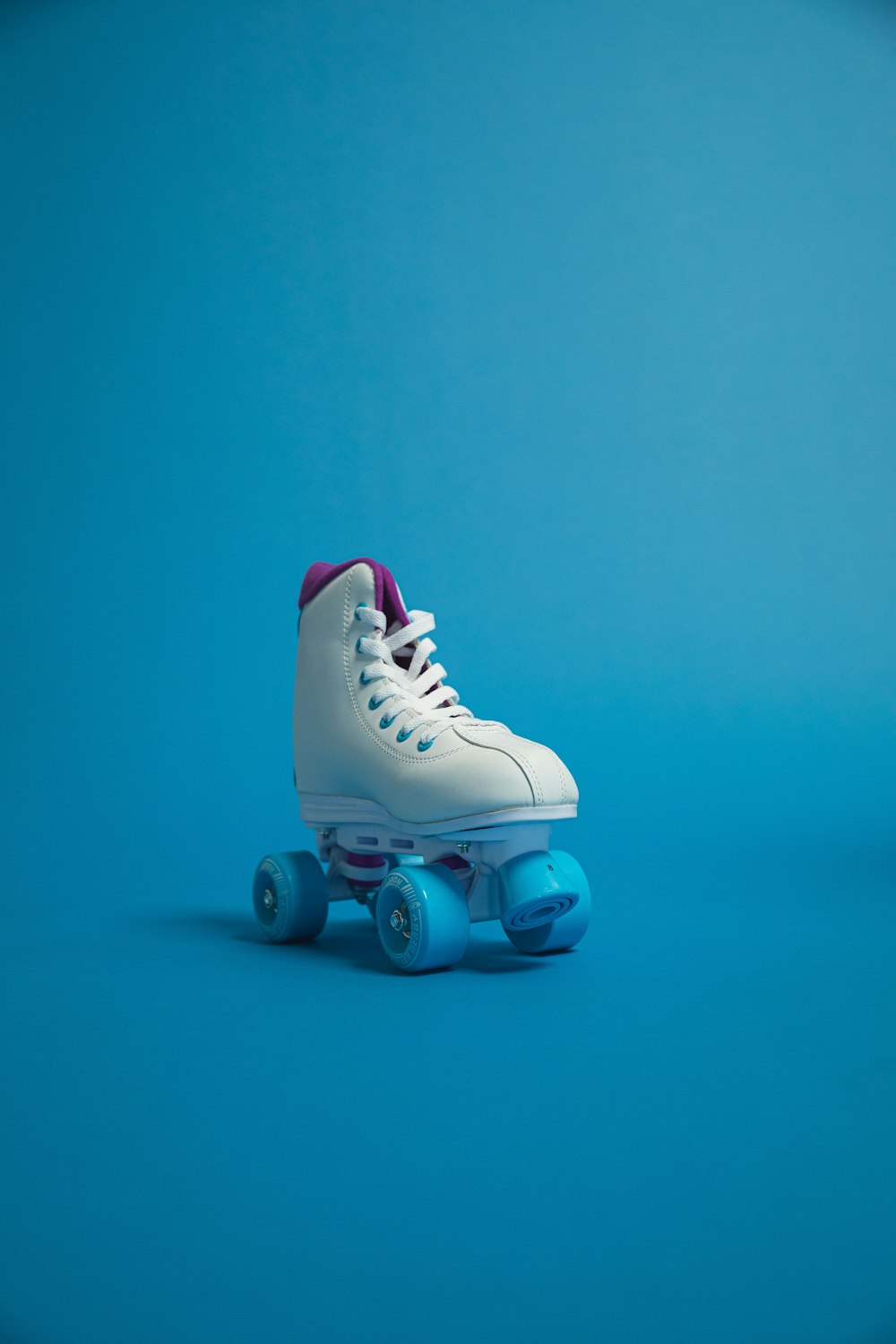 unpaired white and blue roller skate