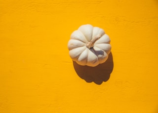 white squash on yellow board