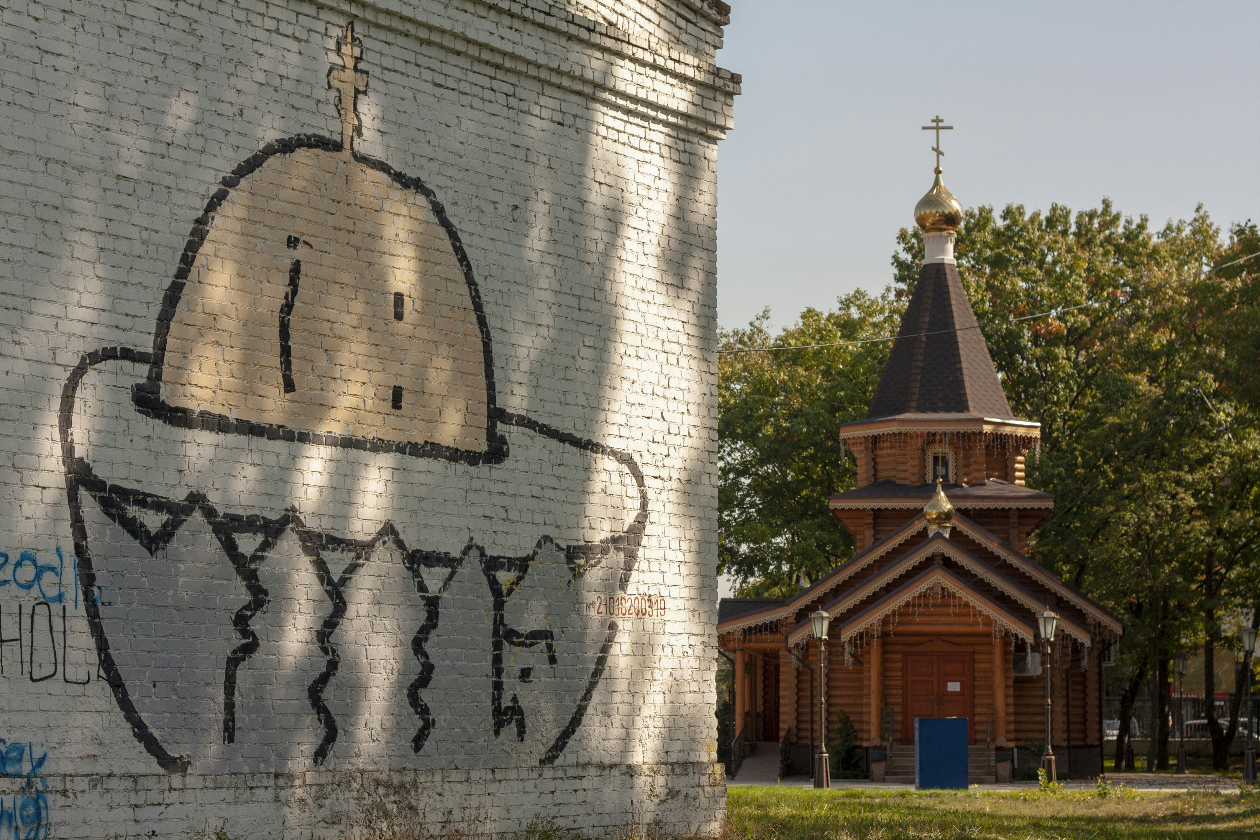 Graffiti near small church at the Kuban State Agrarian University