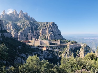 concrete building on the side of a mountain