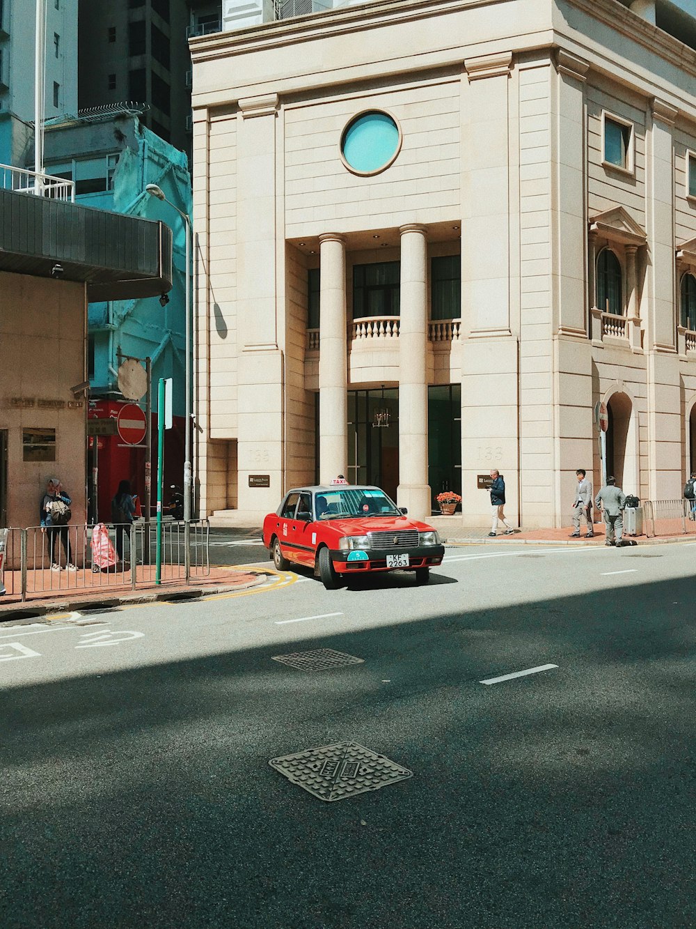 red car near building