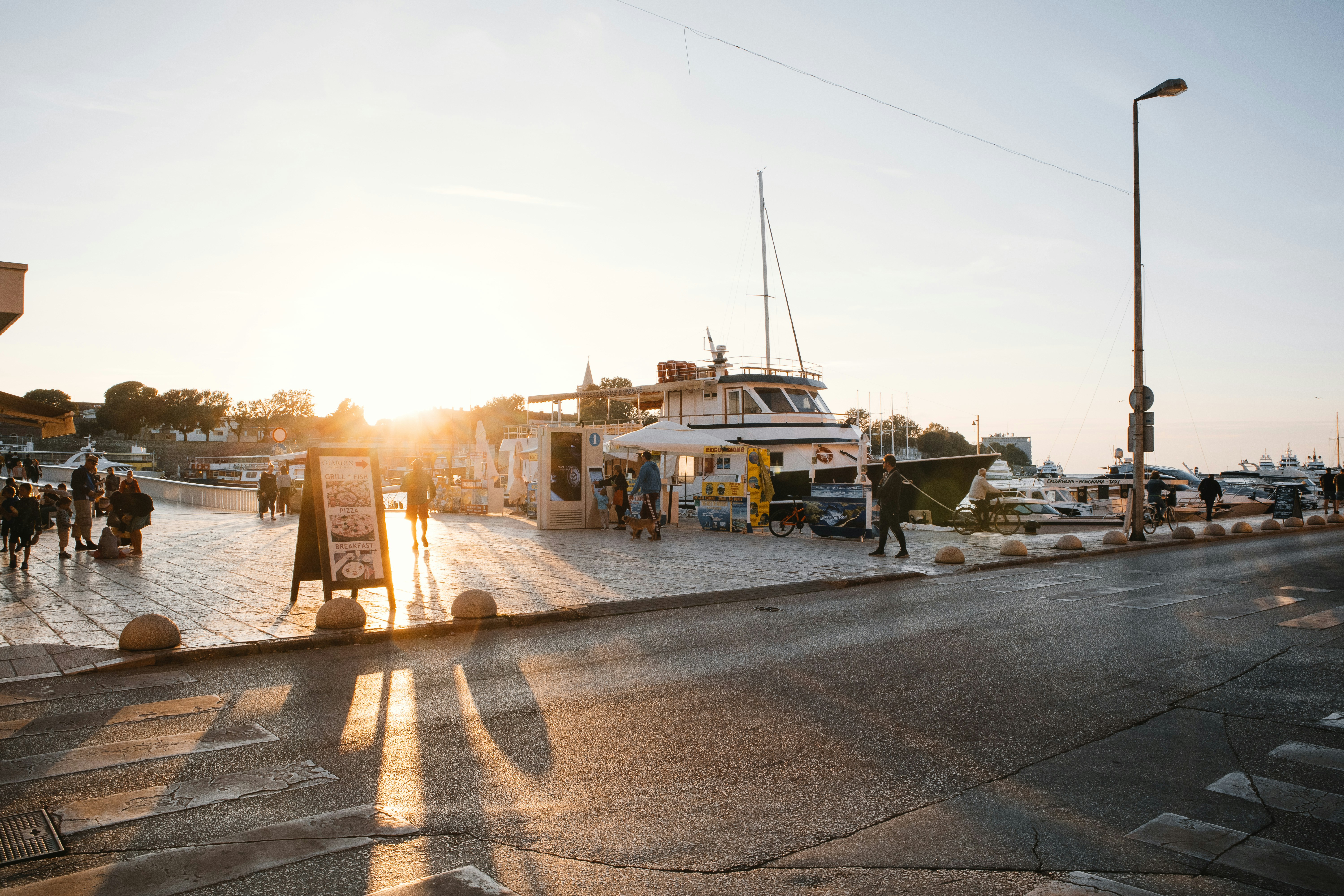 people standing beside boat at daytime