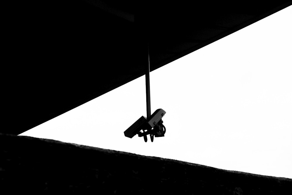 a black and white photo of a plane in the air