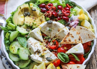 sliced vegetables in white ceramic bowl