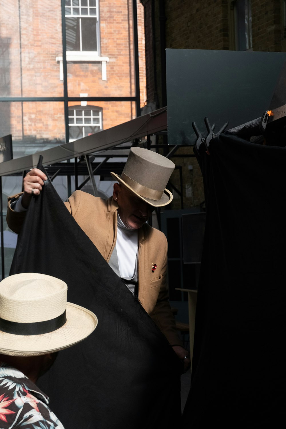 man holding a black fabric cover