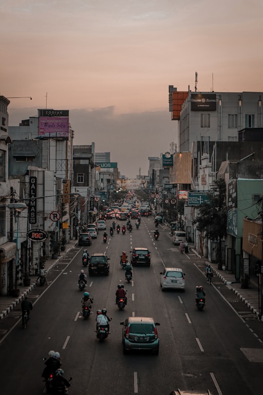 vehicles running on road in Bandung Indonesia