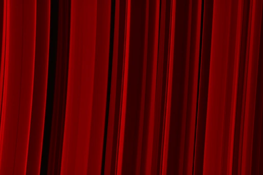 a red curtain with a black background