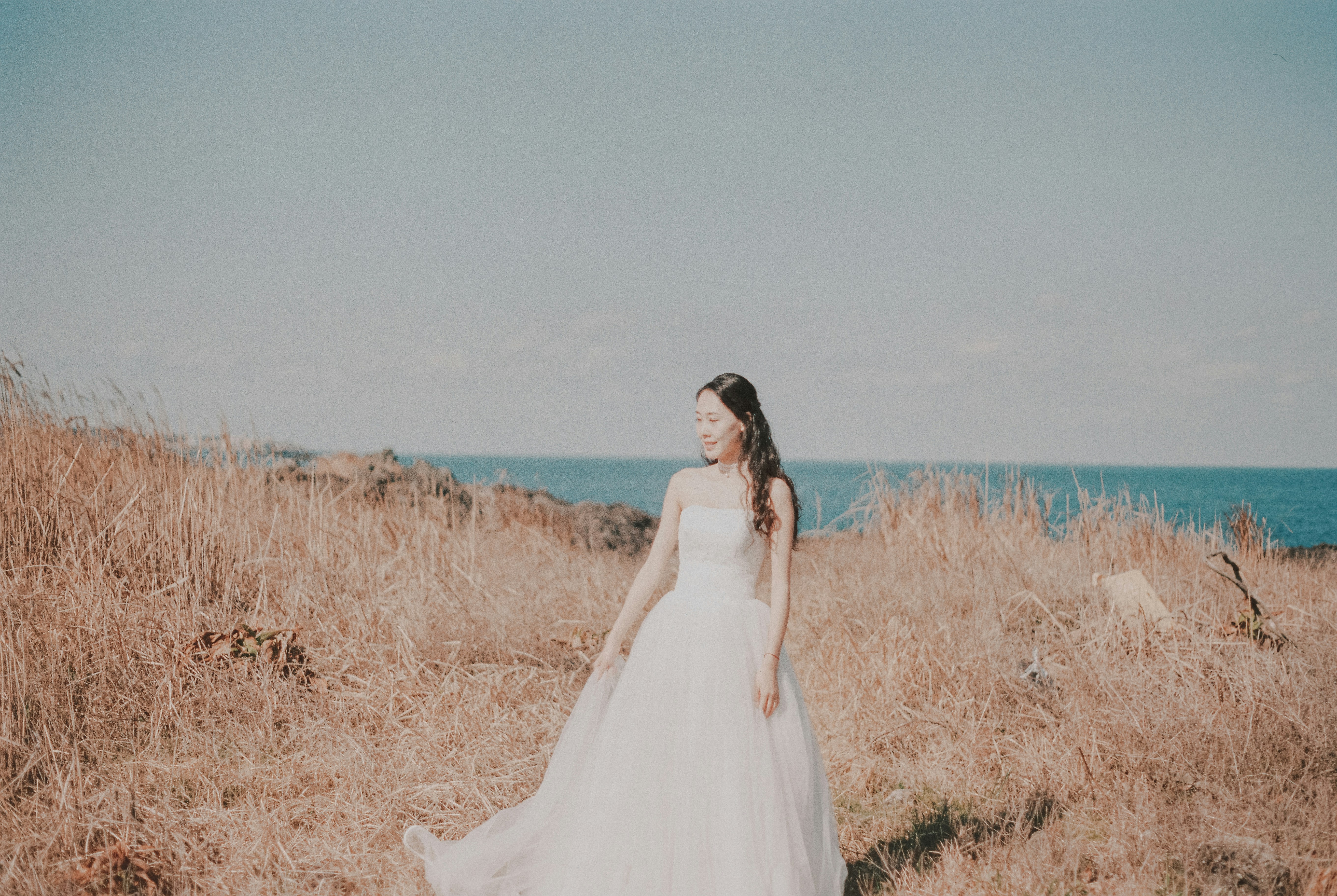 woman in white wedding dress on mountain