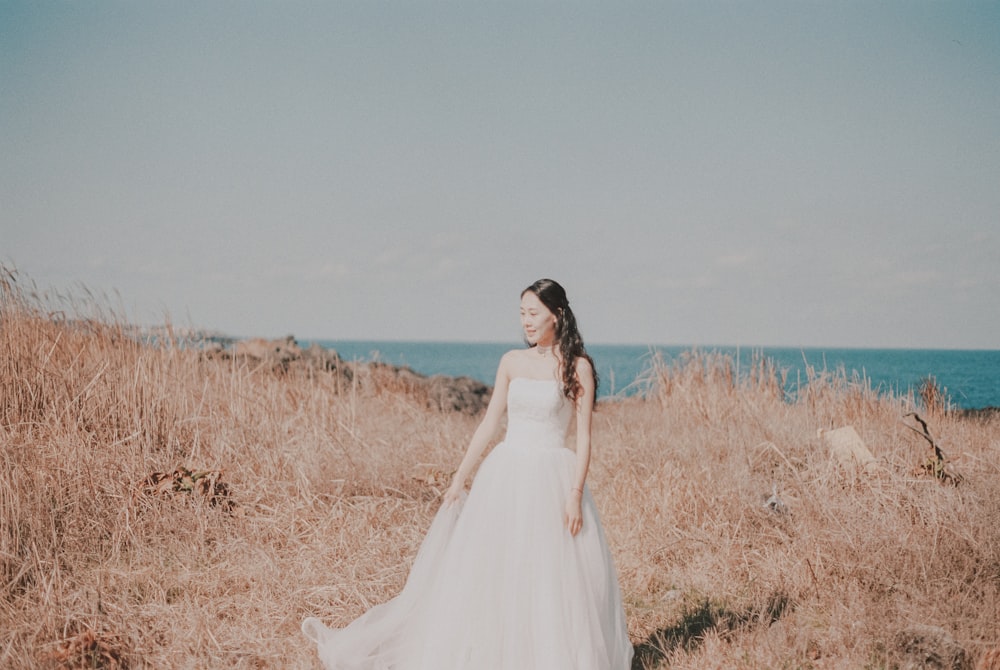 woman in white wedding dress on mountain