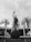 A prominent statue of a figure holding a trophy stands atop a large globe-like base inscribed with 'BRASIL 1958 1962'. The statue is surrounded by tall palm trees, and in the background, there's a large circular building with columns.