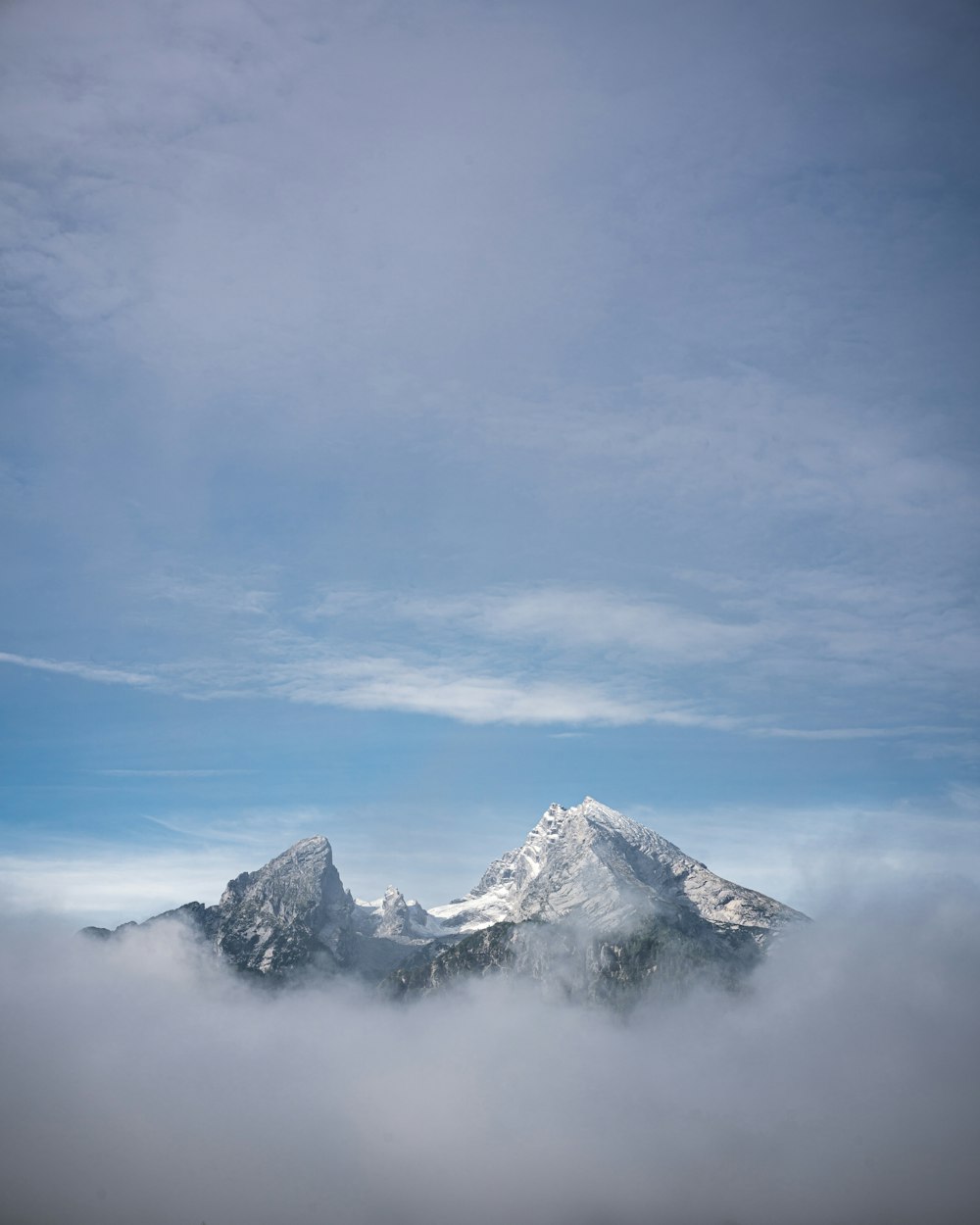 snow covered mountain under blue sky during daytime