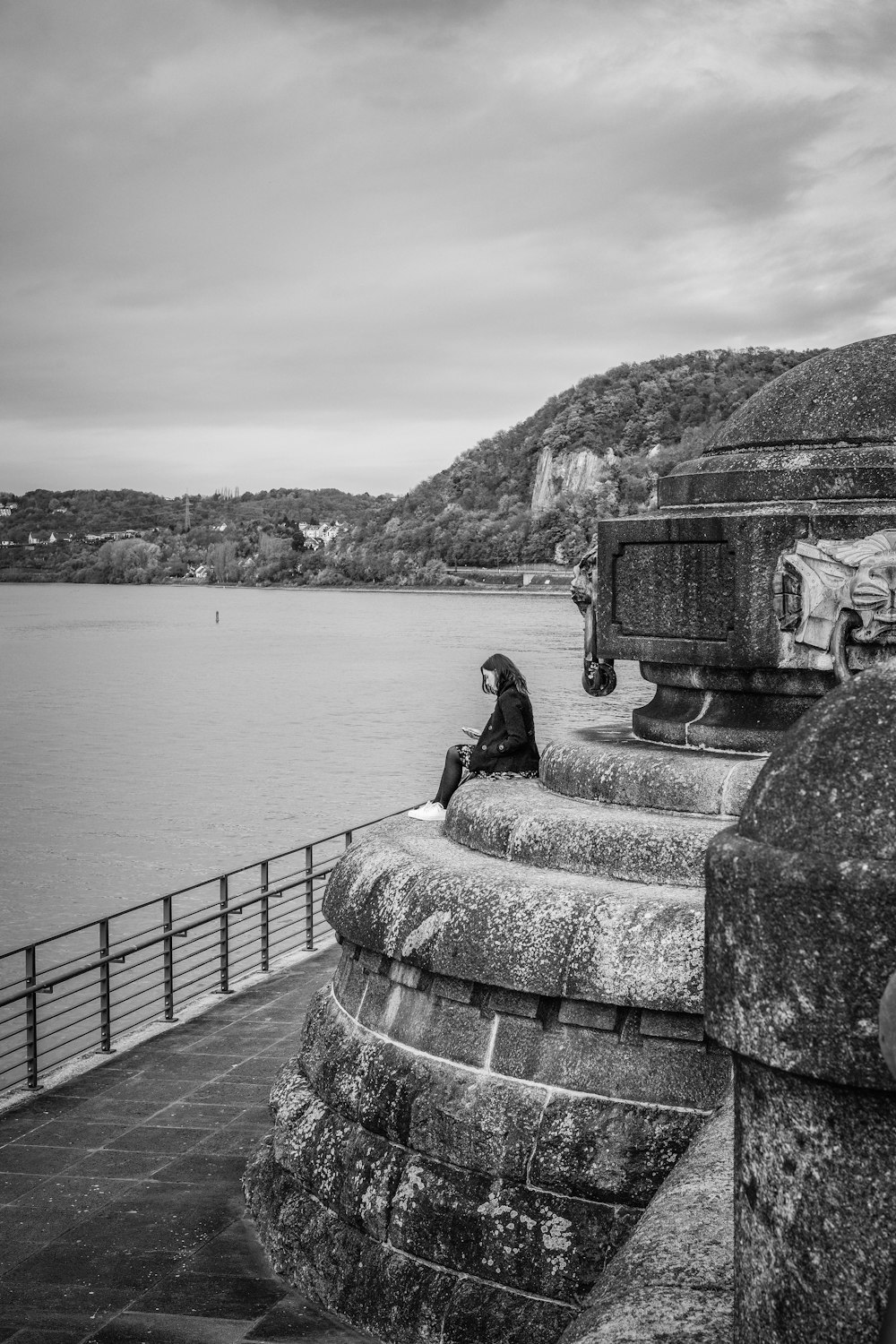 woman sitting on statue