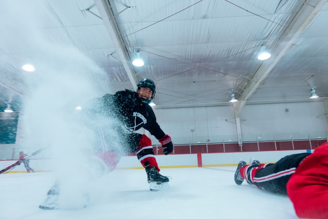 A hockey player in action, skating on the ice.