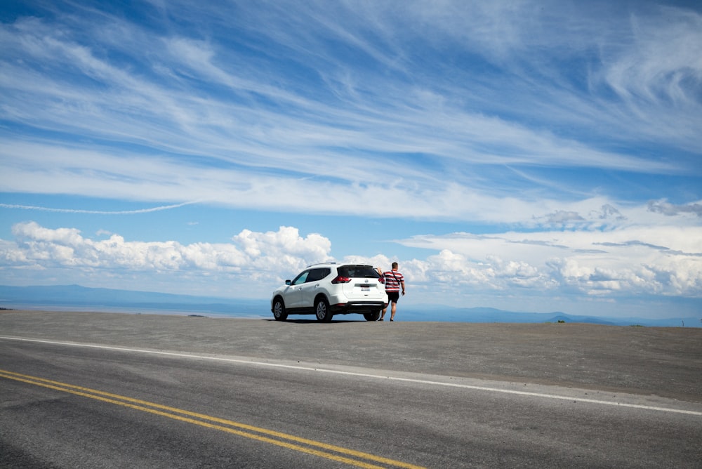 white SUV under blue sky