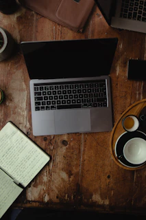 A warm, inviting workspace with a laptop and a notebook ready for a counseling session