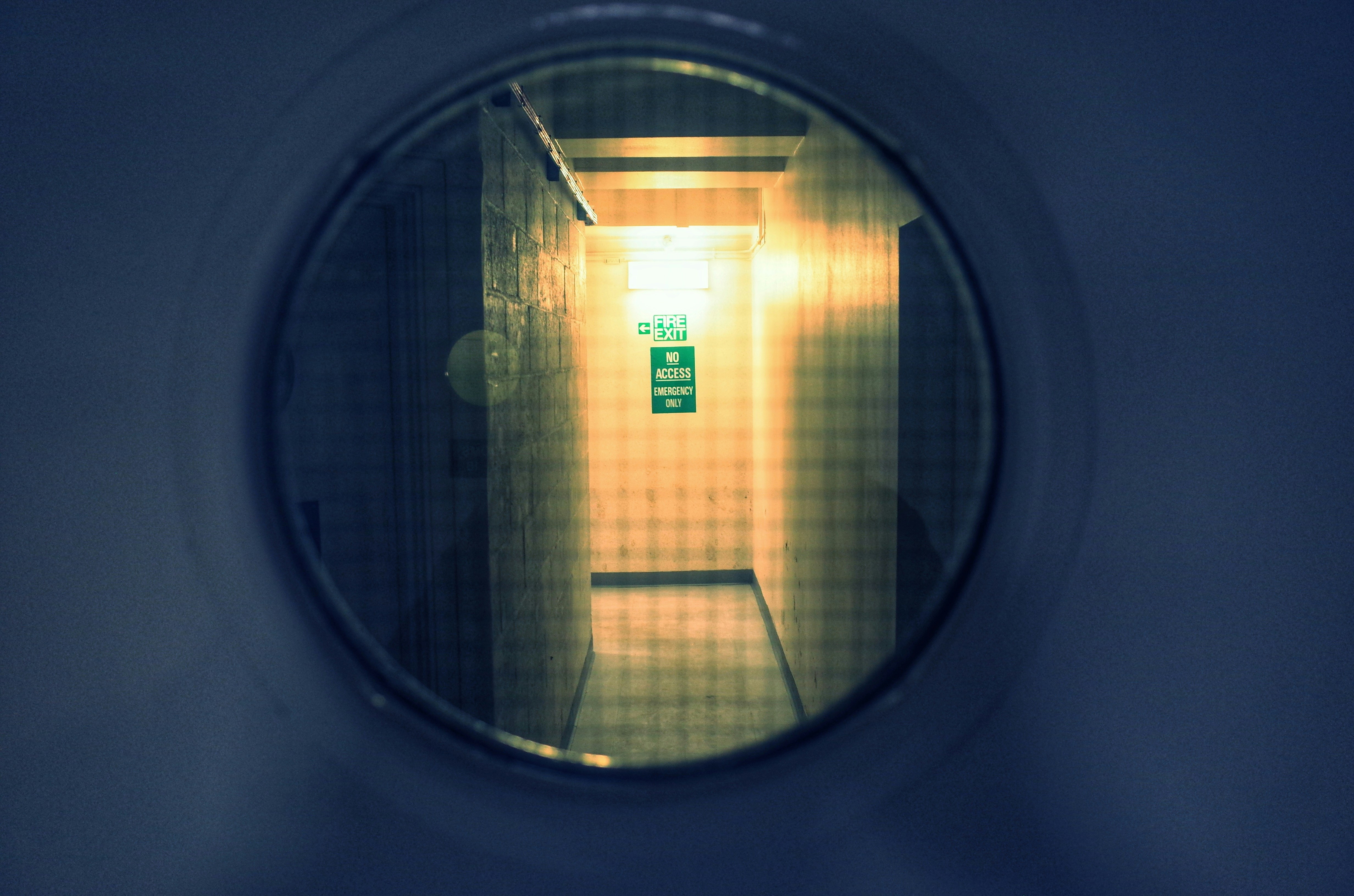 a reflection of a door in a mirror