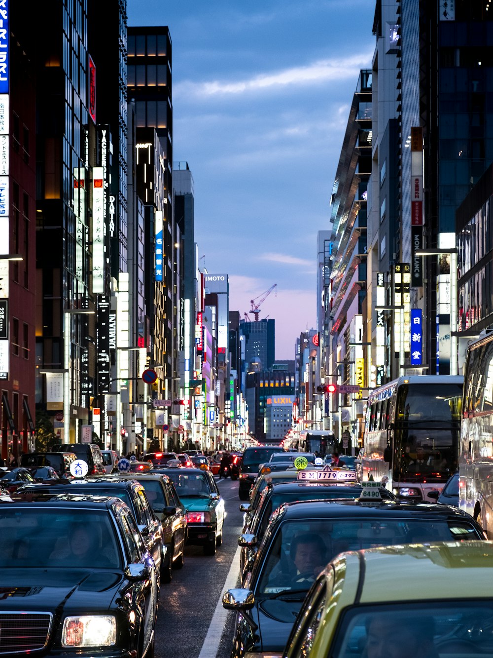 photography of vehicles traveling on road during daytime