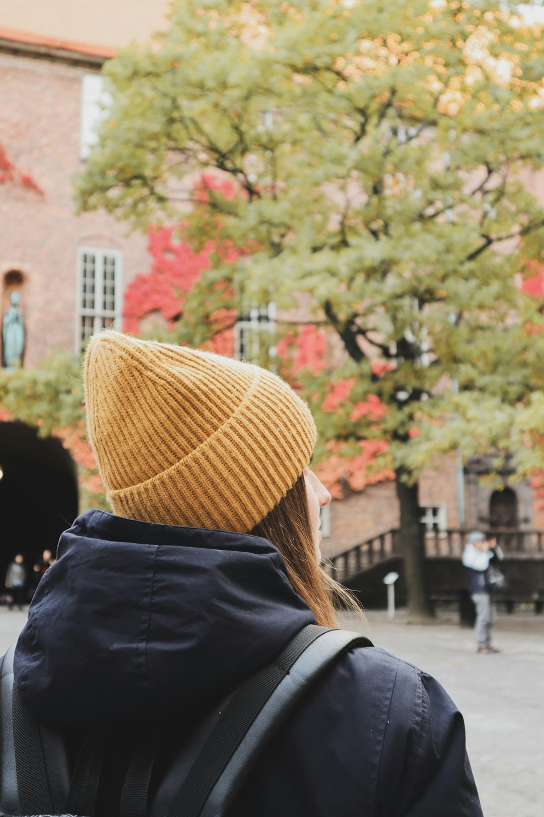 woman wears brown knit