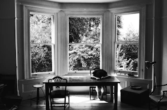 grayscale photography of rectangular table