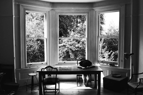 grayscale photography of rectangular table