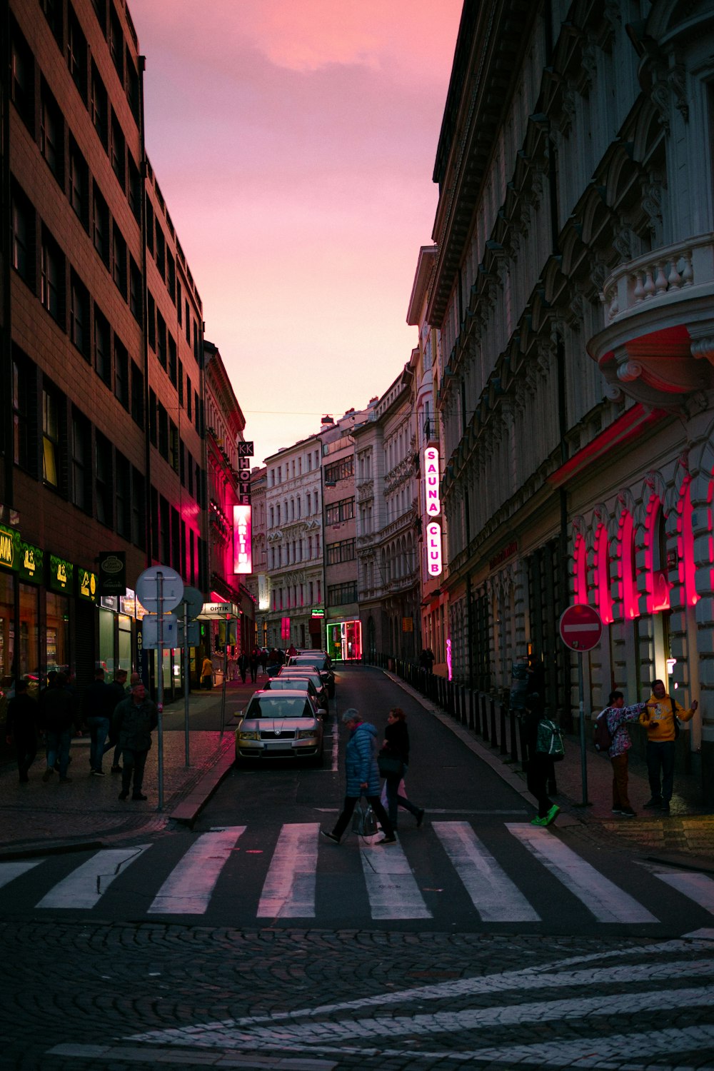 people walking on street during golden hour