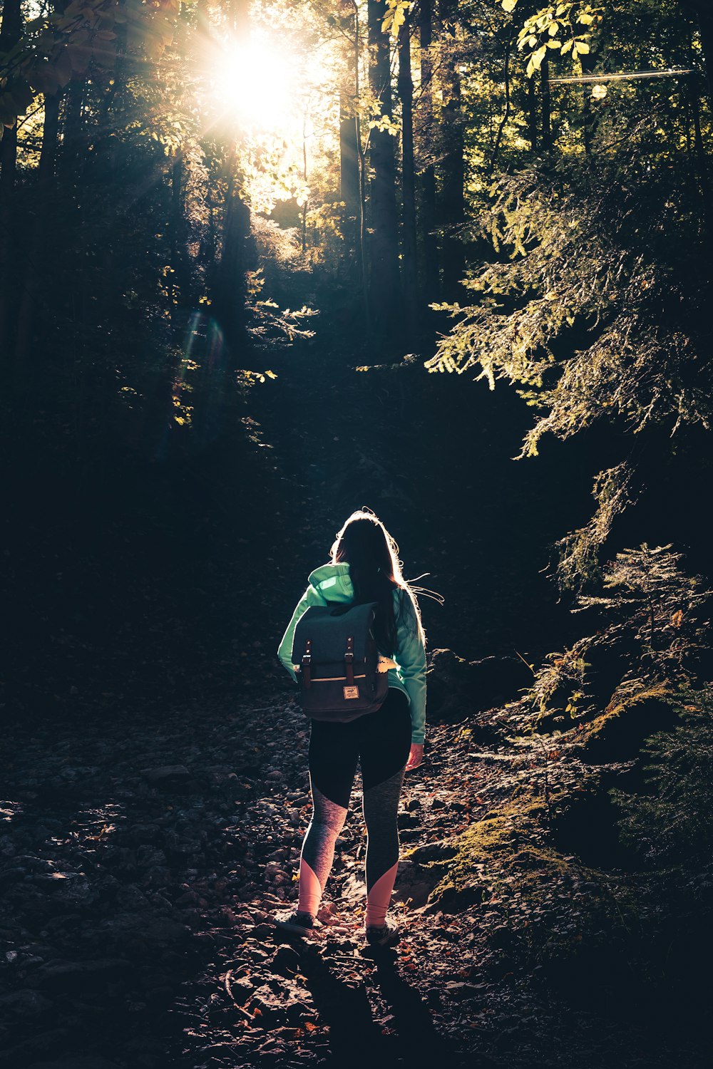 woman walking in forest during daytime