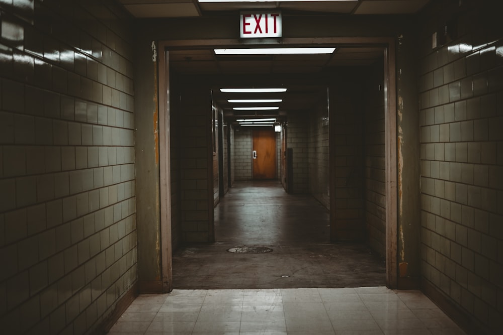 empty hallway with fire exit signage