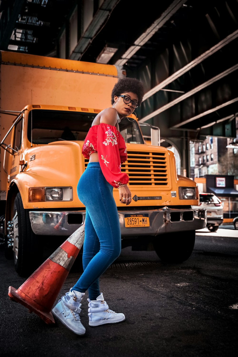 women's red long-sleeved crop top and blue leggings