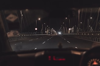 vehicle traveling on road during nighttime