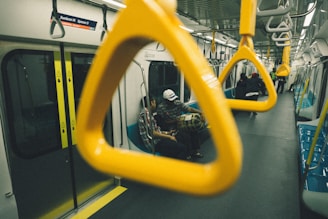 people sitting inside train during daytime