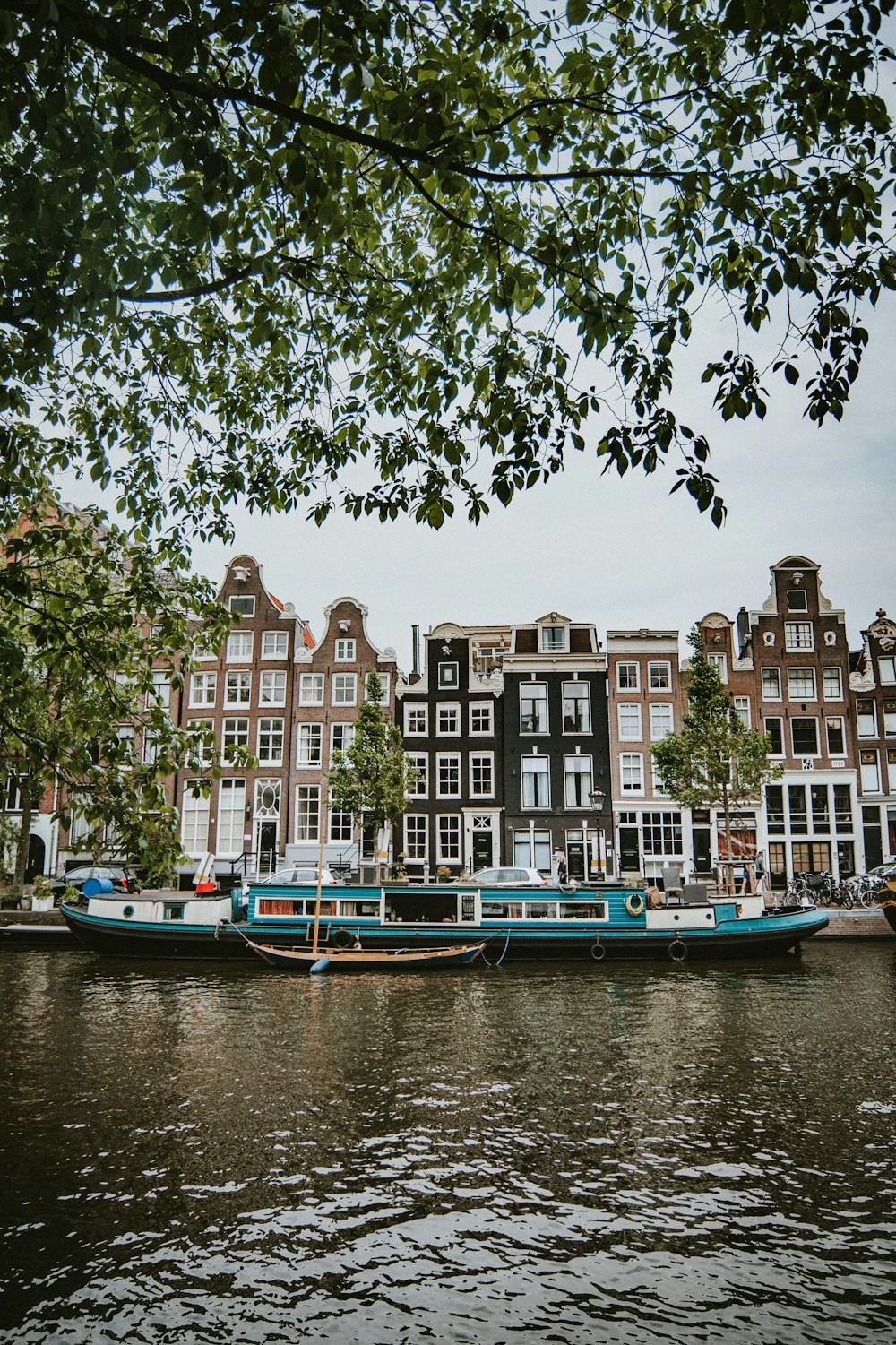 boat in body of water near buildings