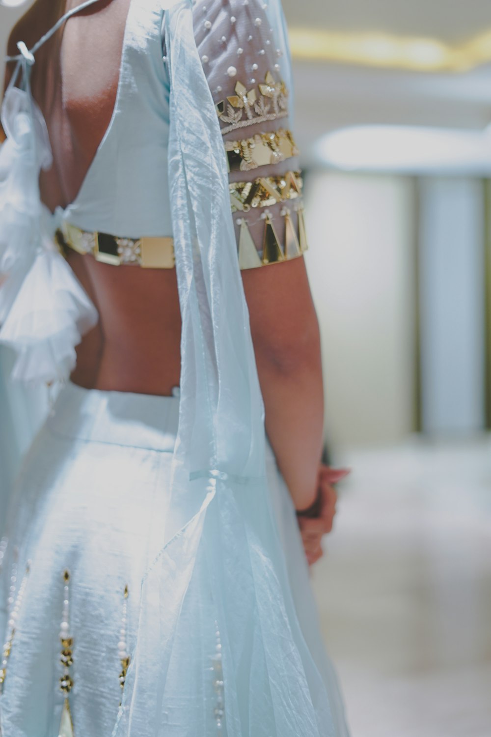 woman in white and gold dress