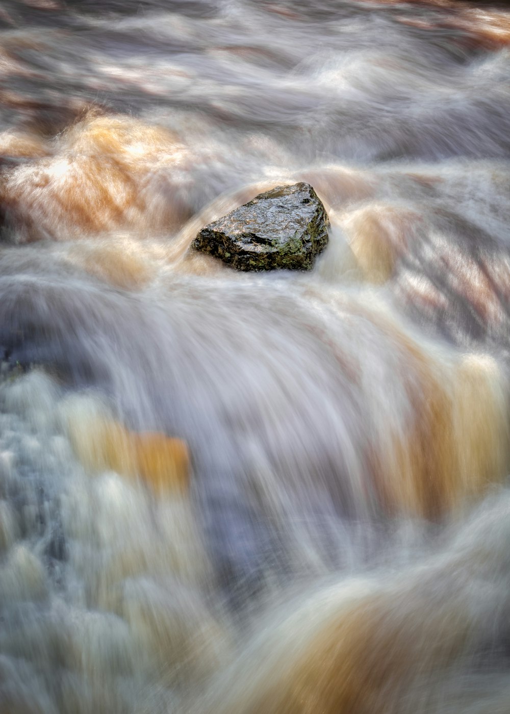 closeup photo of body of water in timelapse photo