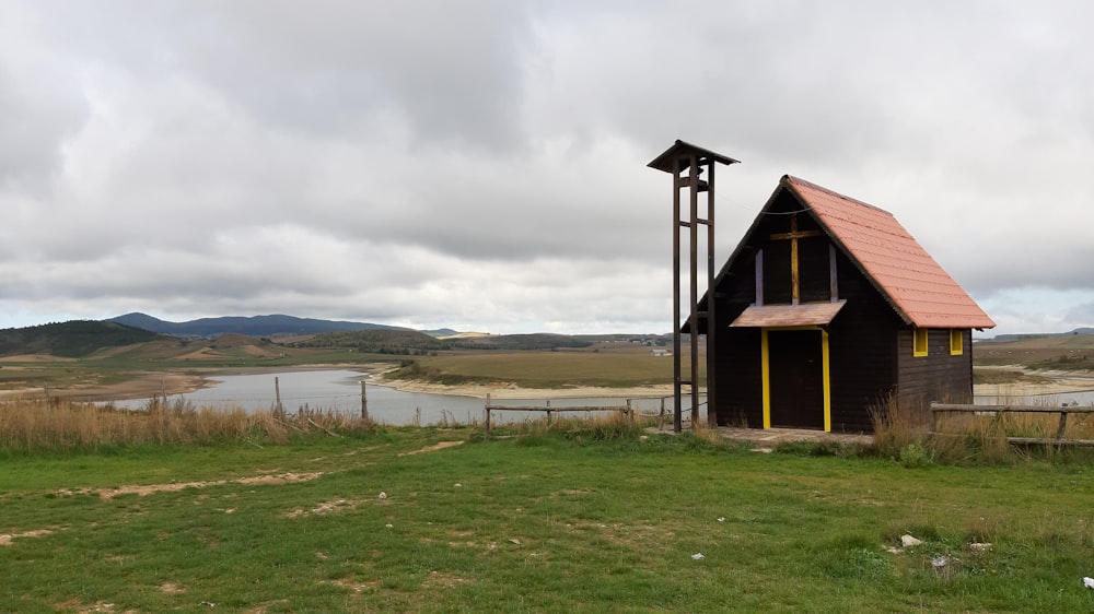 brown house near body of water