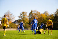 Footballer taking a shot on goal during a match