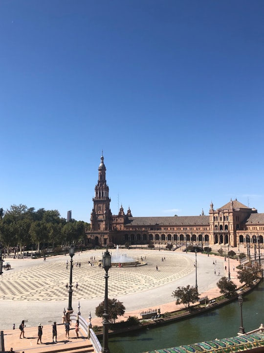 people standing near chuch in Plaza de España Spain