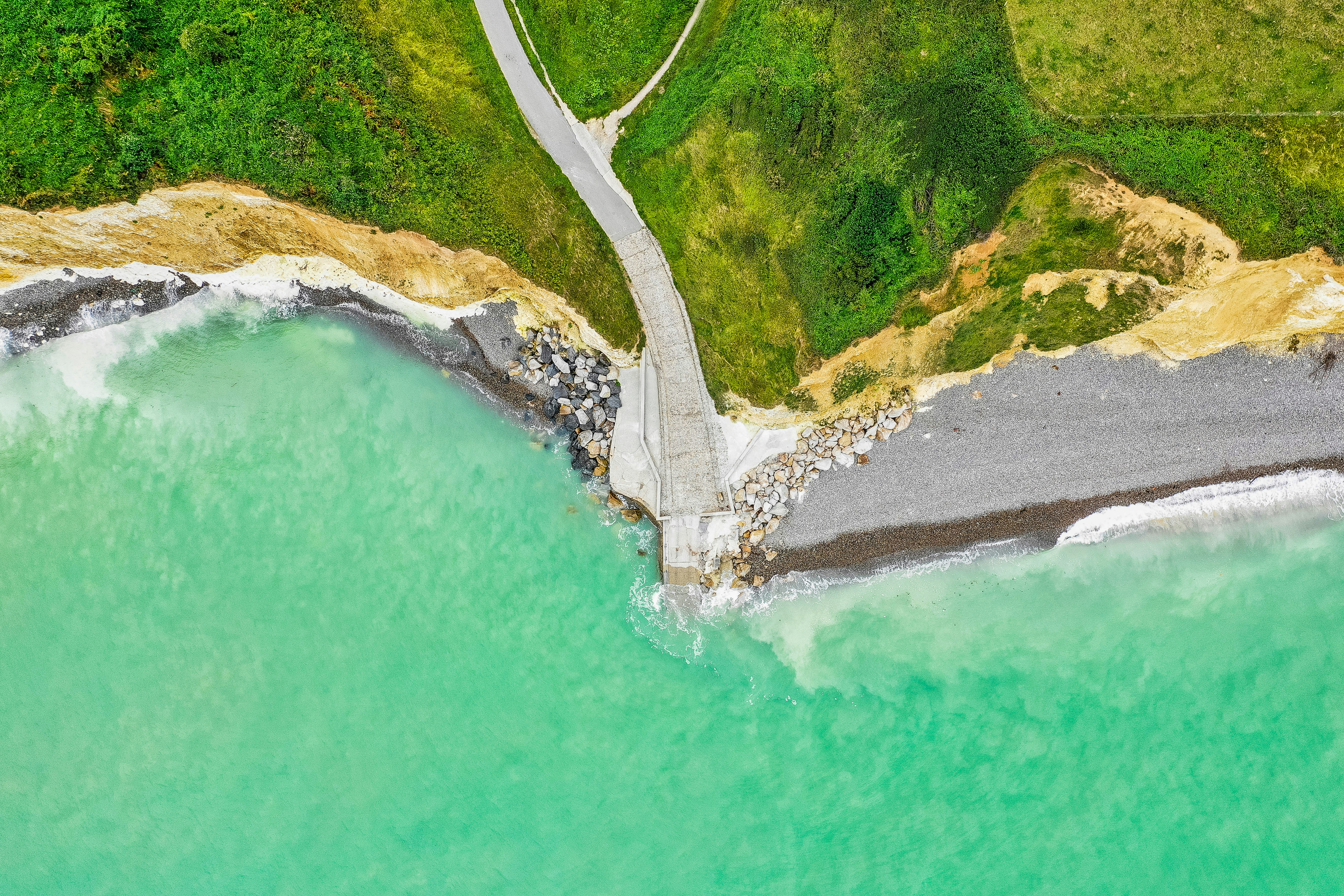aerial photography of beach and land