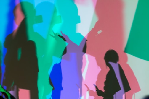 An artistic creative photo blending shadows and vibrant colors.