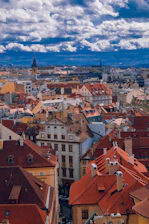 Aerial view of Ambato city with elegant homes inspired by castle designs.